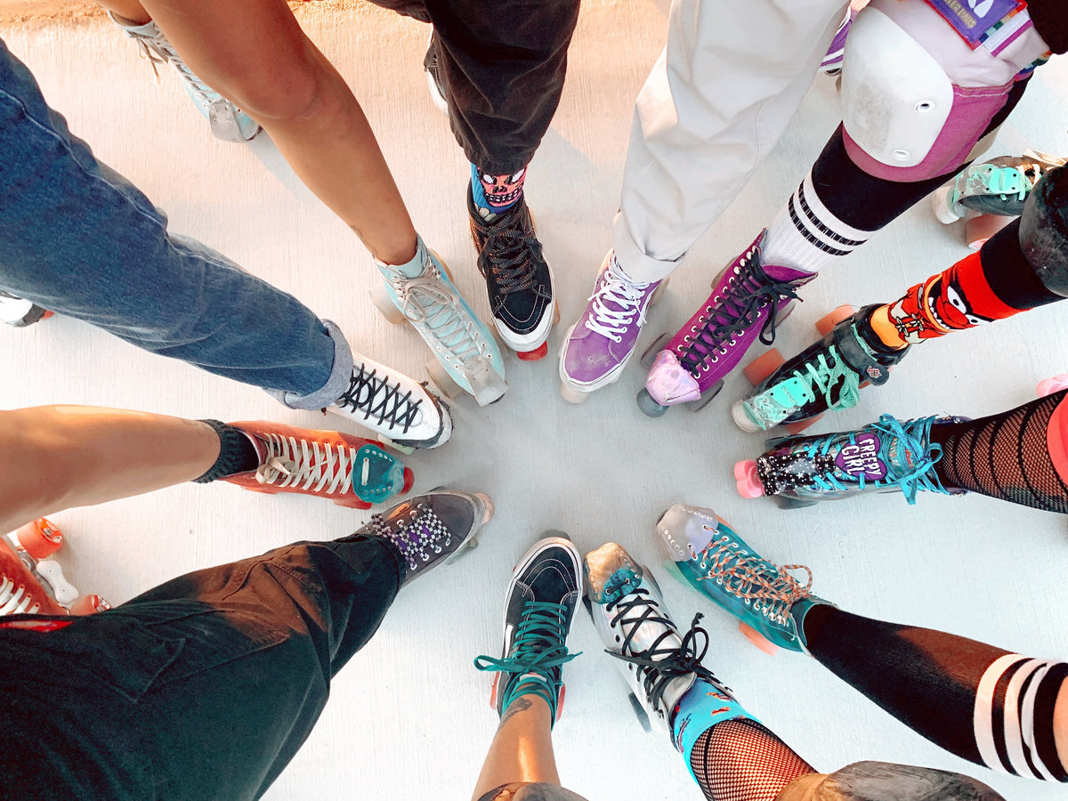 12 different Roller skates of various colors, styles, and brands, all in a circle